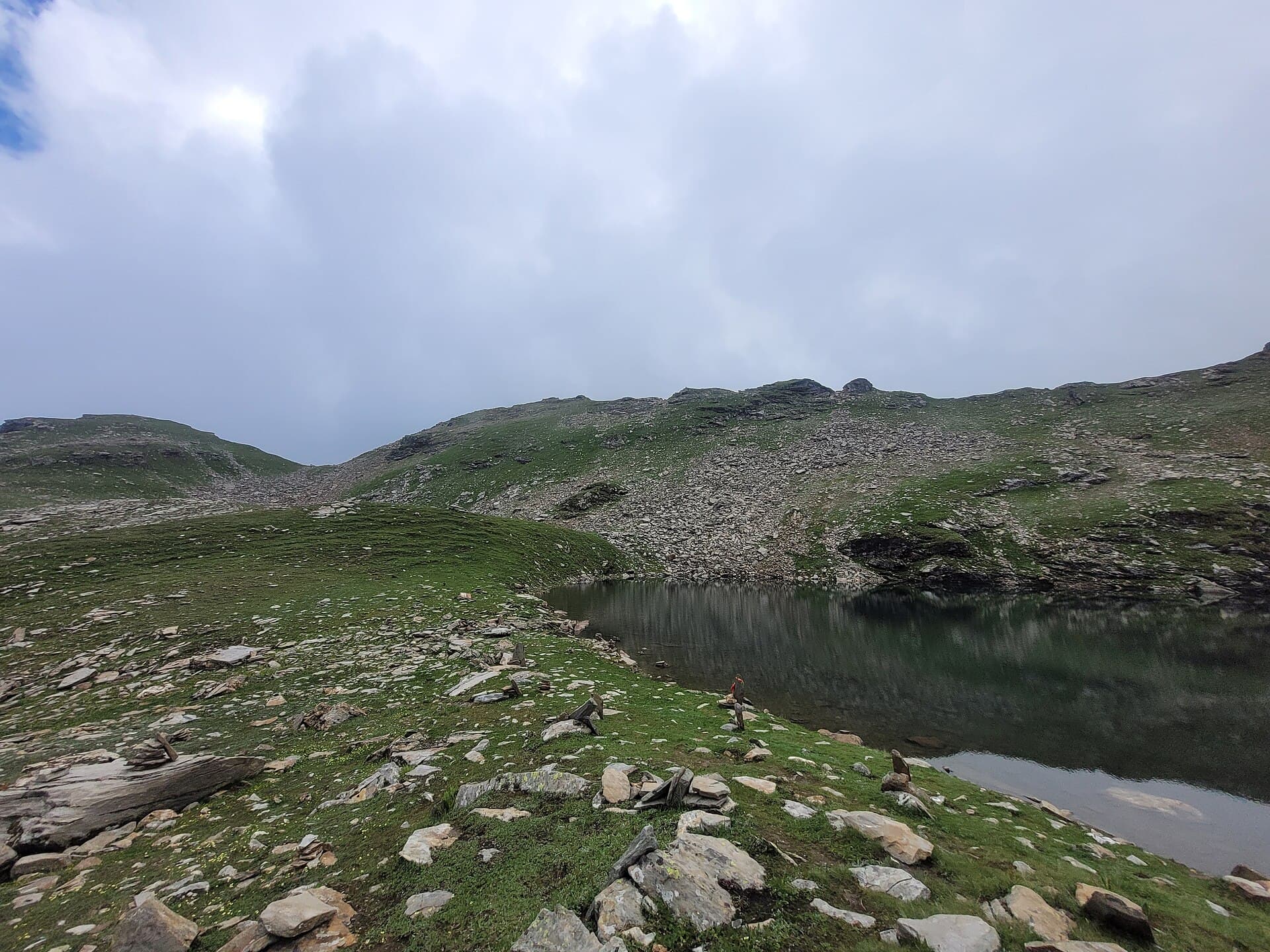 Cloud forest trail disappearing into fog near Bhrigu Lake