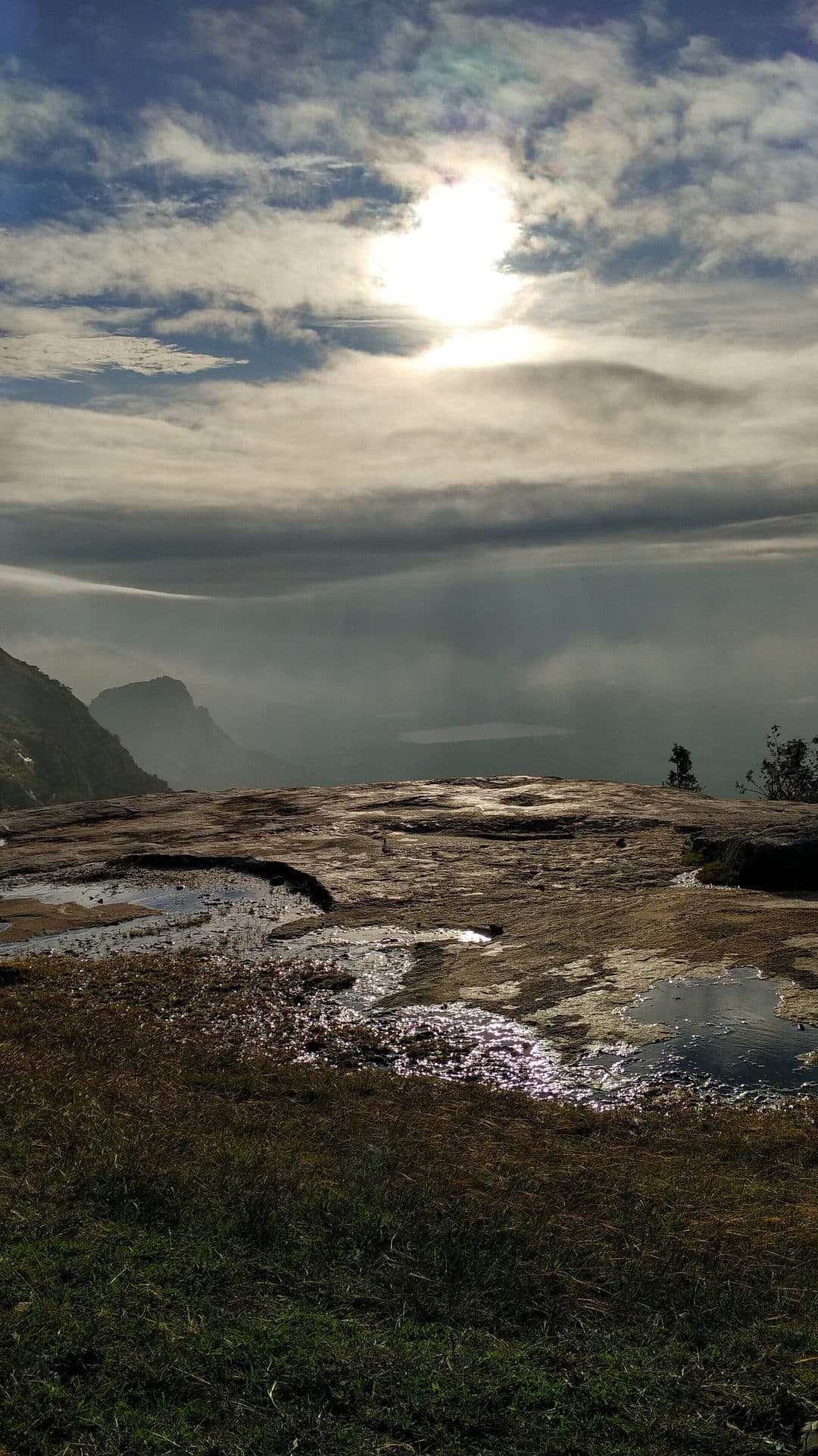 Sunrise breaking through clouds over the rock summit at Kaiwara Betta