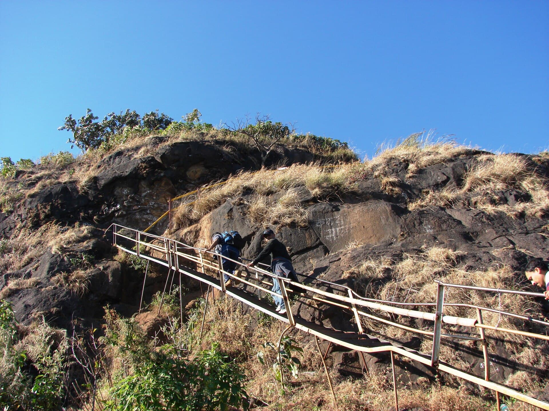 Rock-cut steps and iron ladders on the upper Kalsubai trail