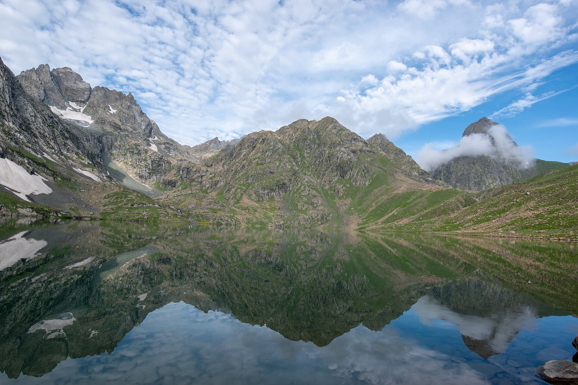 Vishansar Lake near Sonamarg in the Kashmir Himalaya, ringed by grazing meadows and high ridgelines
