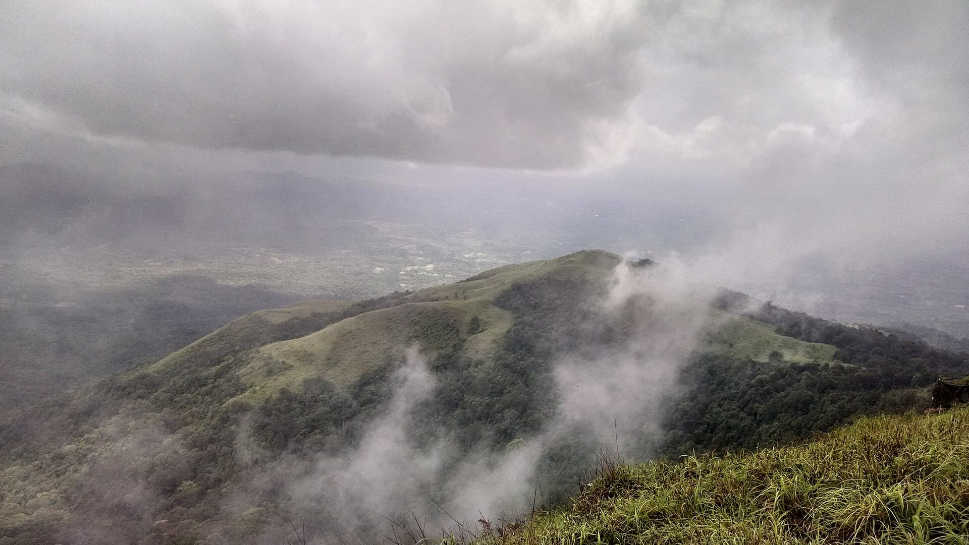 Kurinjal peak rising above a sea of clouds in Kudremukh National Park