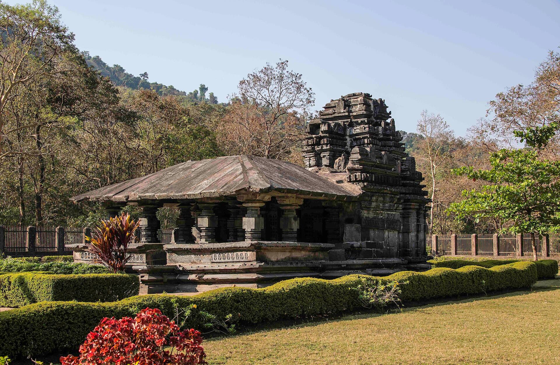 The 13th-century black basalt Mahadev Temple at Tambdi Surla, surrounded by forest