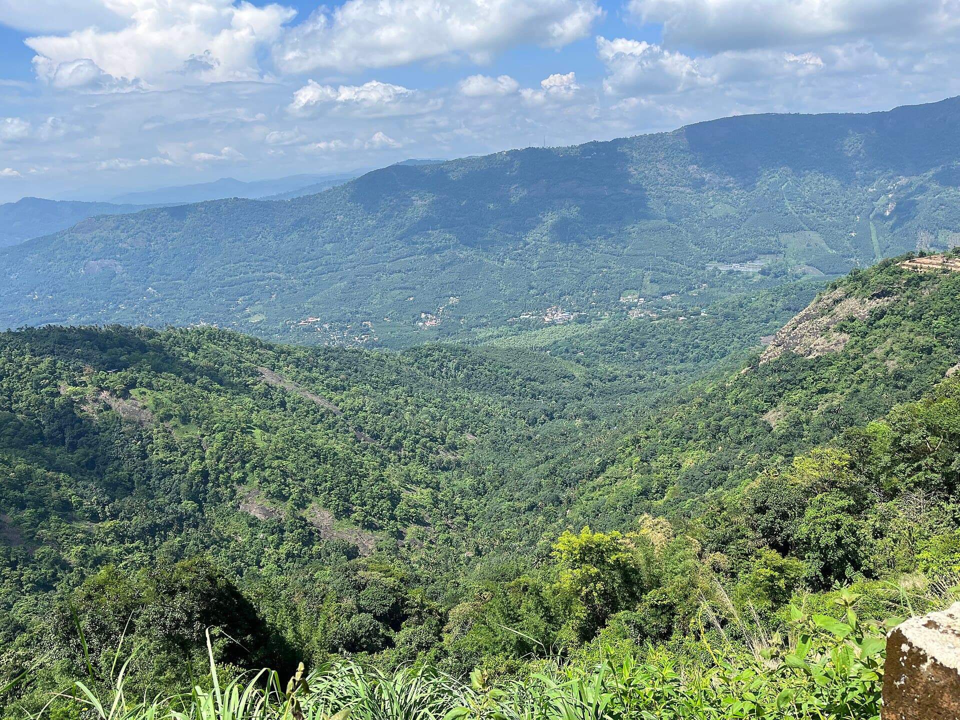 Rolling green hills of Vagamon under a wide sky